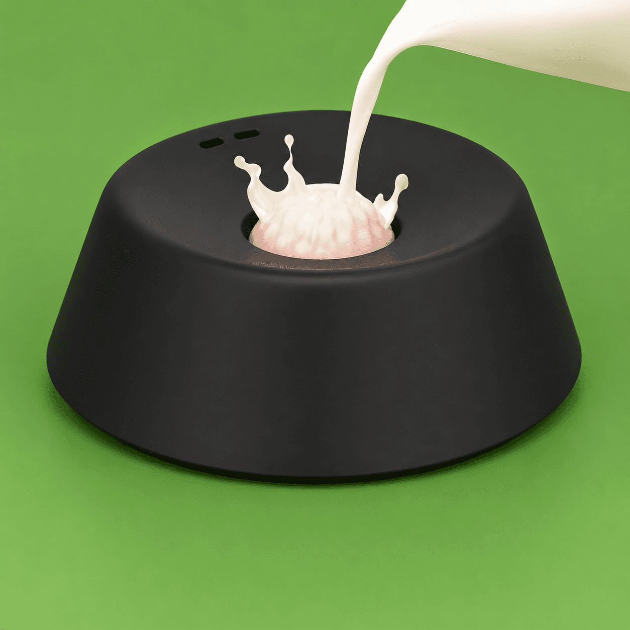 Clero black pet bowl with central raised design and milk being poured on green background