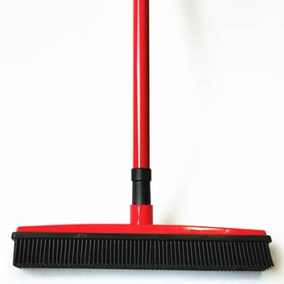 Clero red broomstick broom with black bristles designed for pet accessory cleaning